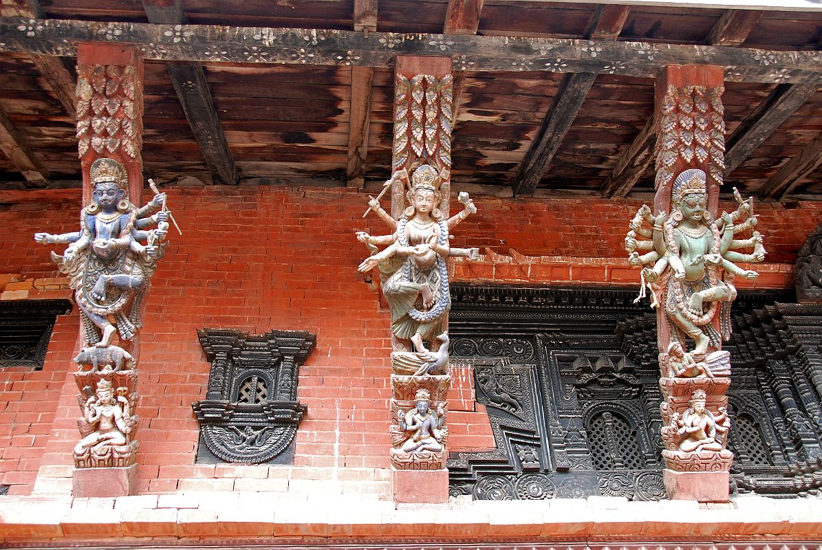 Kathmandu Patan Durbar Square Mul Chowk 22 Three Carved Wooden Roof Struts Of Many Armed Wrathful Figures Standing On One Leg 